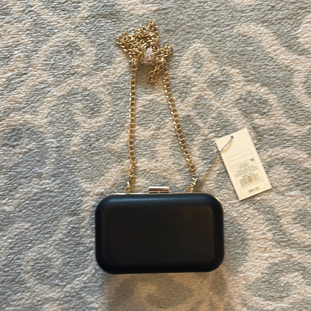 Black clutch with gold hardware